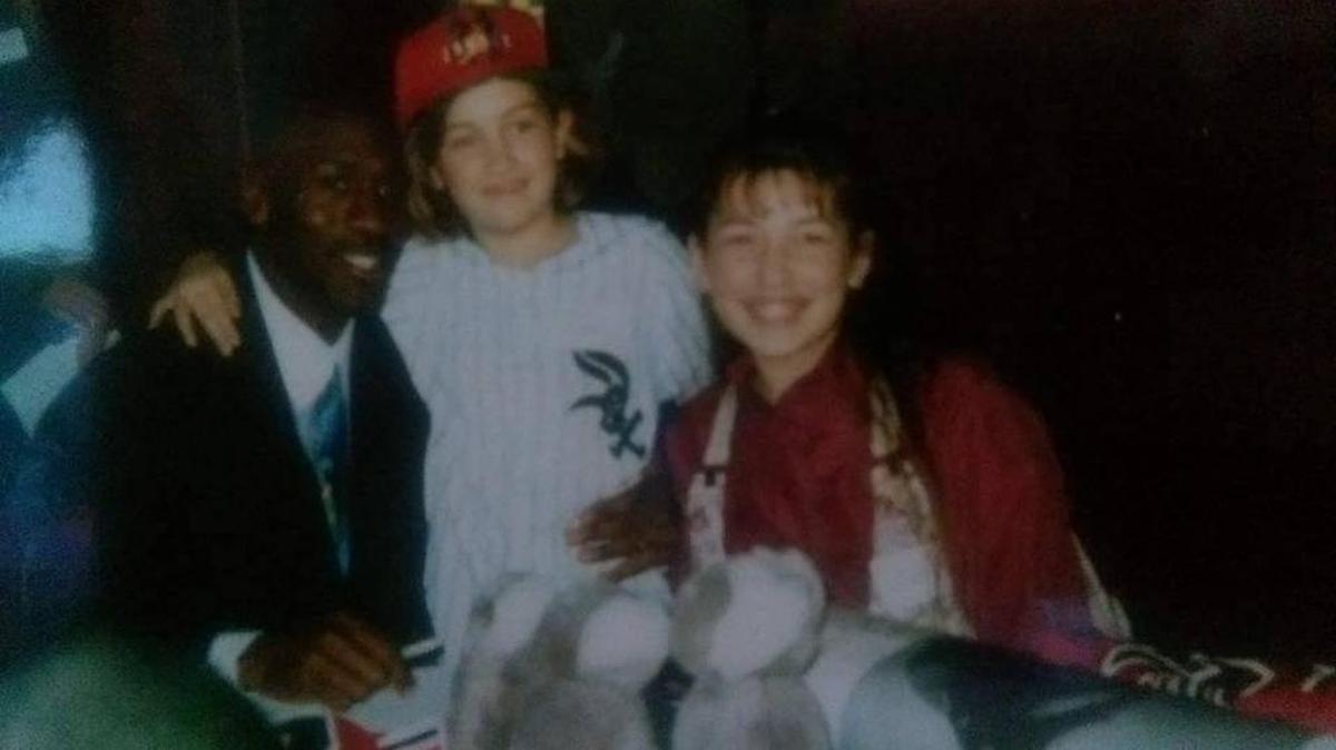 This photo from the 1990s shows NBA great Michael Jordan with the Wisconsin girl, Kelsey Schiel, who received one of his signed jerseys through the Starlight Children’s Foundation.