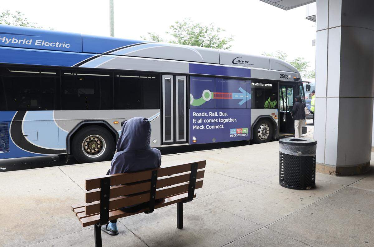 A CATS passenger waits at the Sugar Creek station Tuesday, April 28, 2026 in Charlotte.