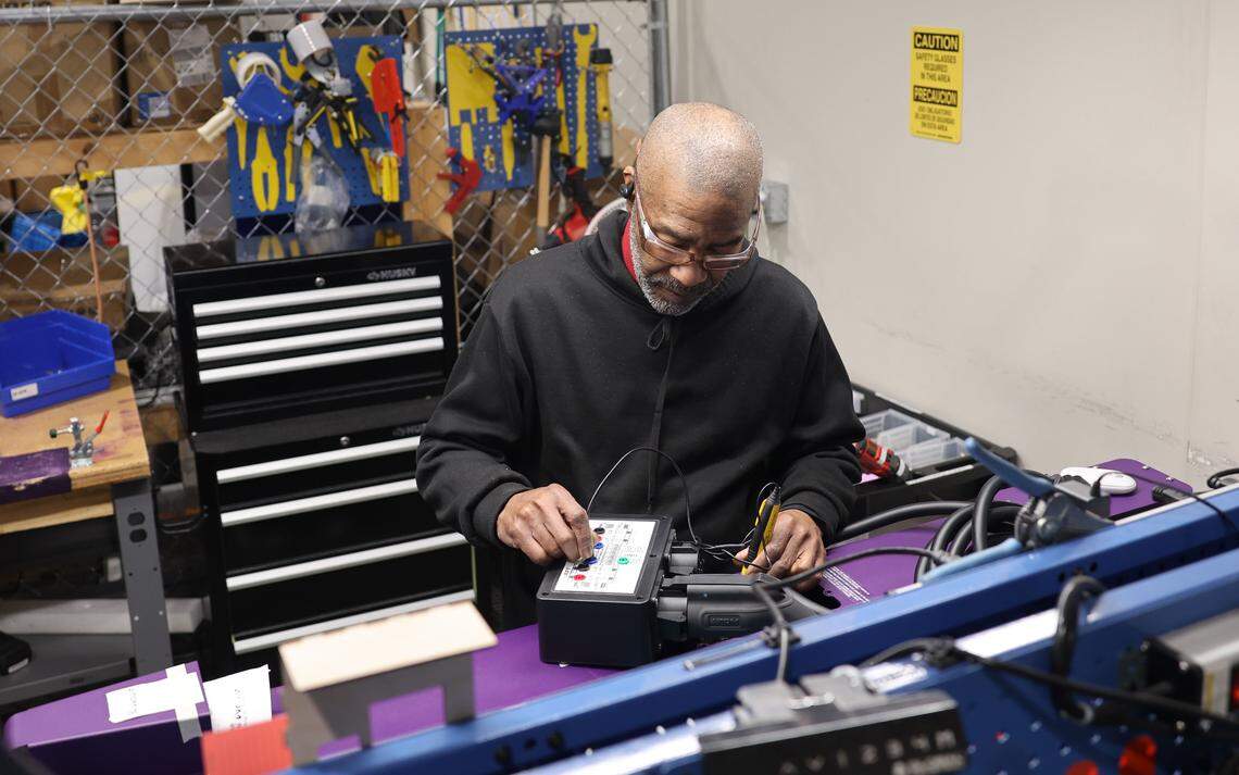 Atom Power employee Benjamin Madison runs tests Feb. 24, 2026, on its solid-state circuit breakers that will be used for electric vehicle charging stations at the Huntersville manufacturing site. The company is expanding into the burgeoning data center industry.