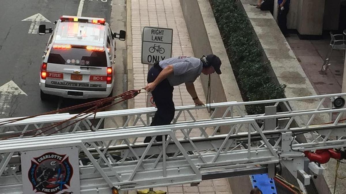 
Firefighters rescued an injured man from beneath a grate outside Two Wells Fargo Center in uptown Charlotte Wednesday morning.

