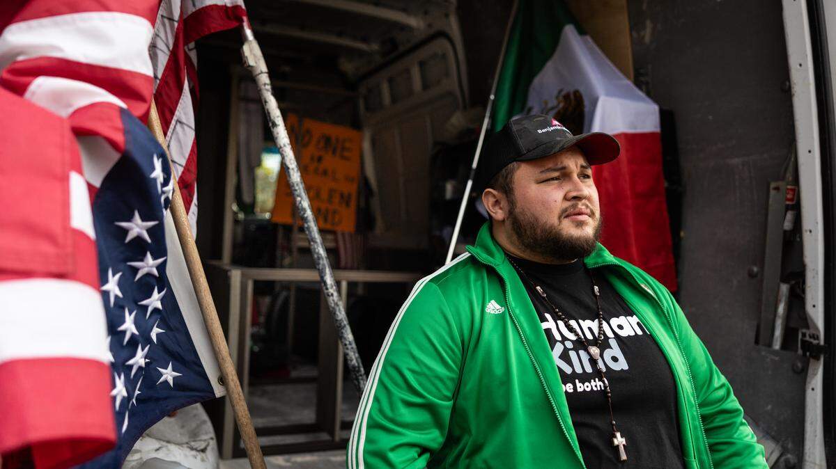 Jesse Pacheco sits on the back of his work truck in Charlotte, N.C., on Monday, November 24, 2025.


