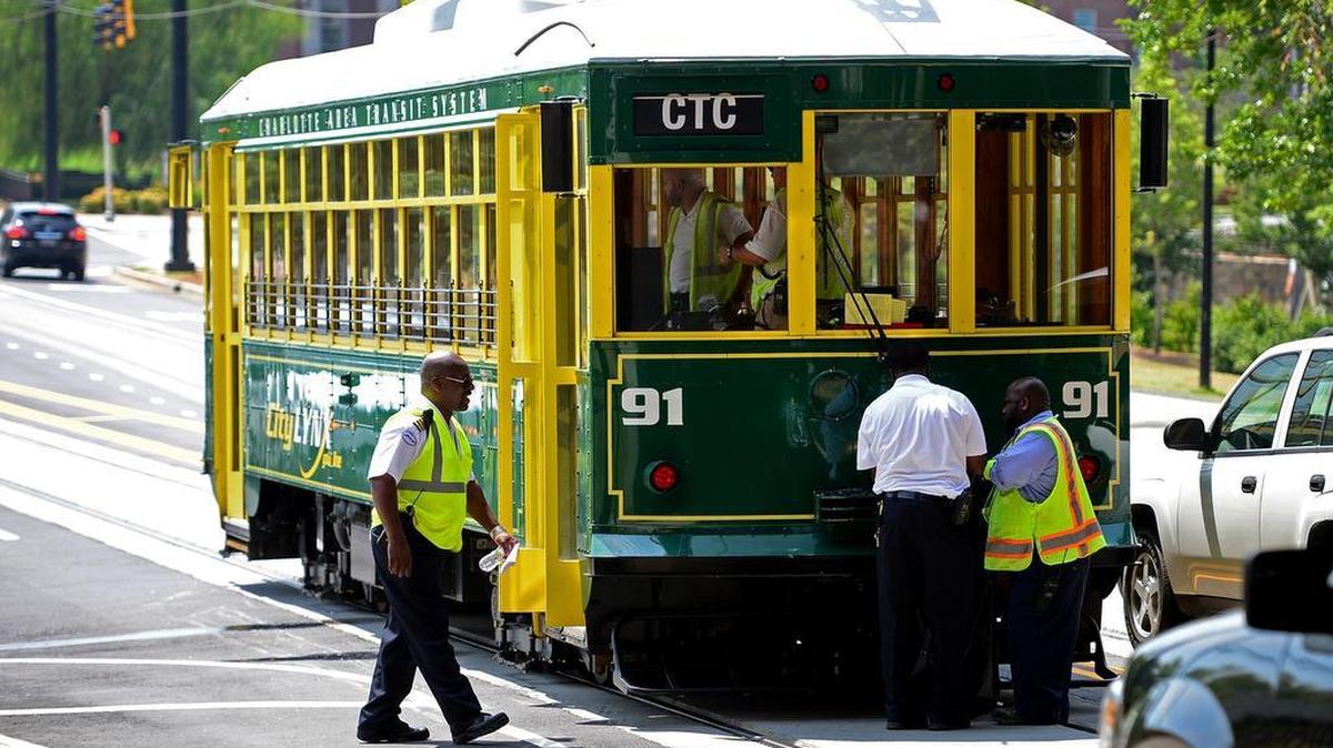 
Workers examine and cleanup the front end of a streetcar on Saturday, July 18, 2015 after it was involved in an accident with a SUV. The incident occurred around 10:30 a.m. when the streetcar rear-ended a sport utility vehicle. The cause of the accident remains under investigation. 
