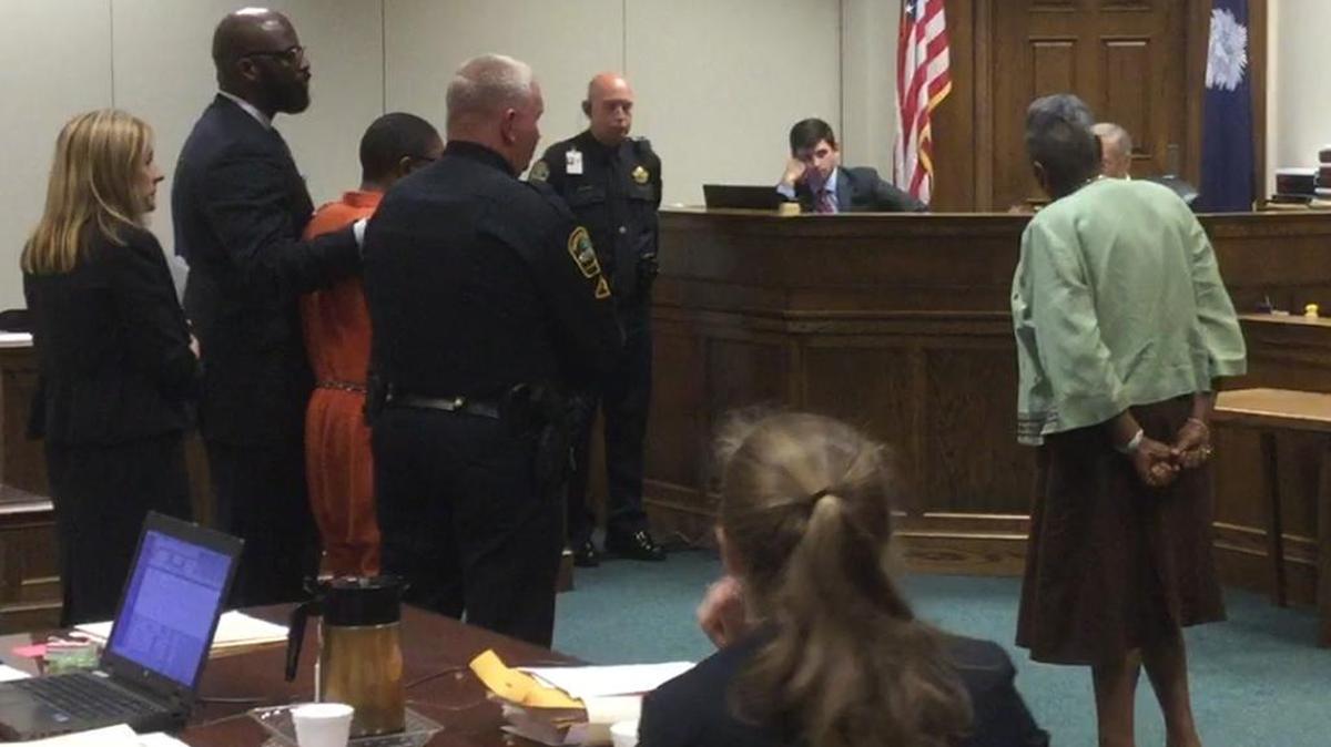 Brenda Hinton, mother of the victim Cyrus Hinton, pleads with Judge Edward Miller in a Spartanburg courtroom Tuesday that her grandson, Osiris, left in orange prison apparel, is not a murderer.