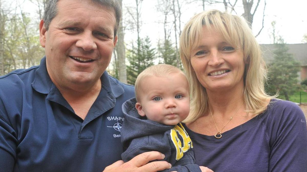 Bob and Martine George with 9-month-old Vincent at home March 25 in Lake Wylie. The family was in the Brussels airport at the time of the blasts March 22.