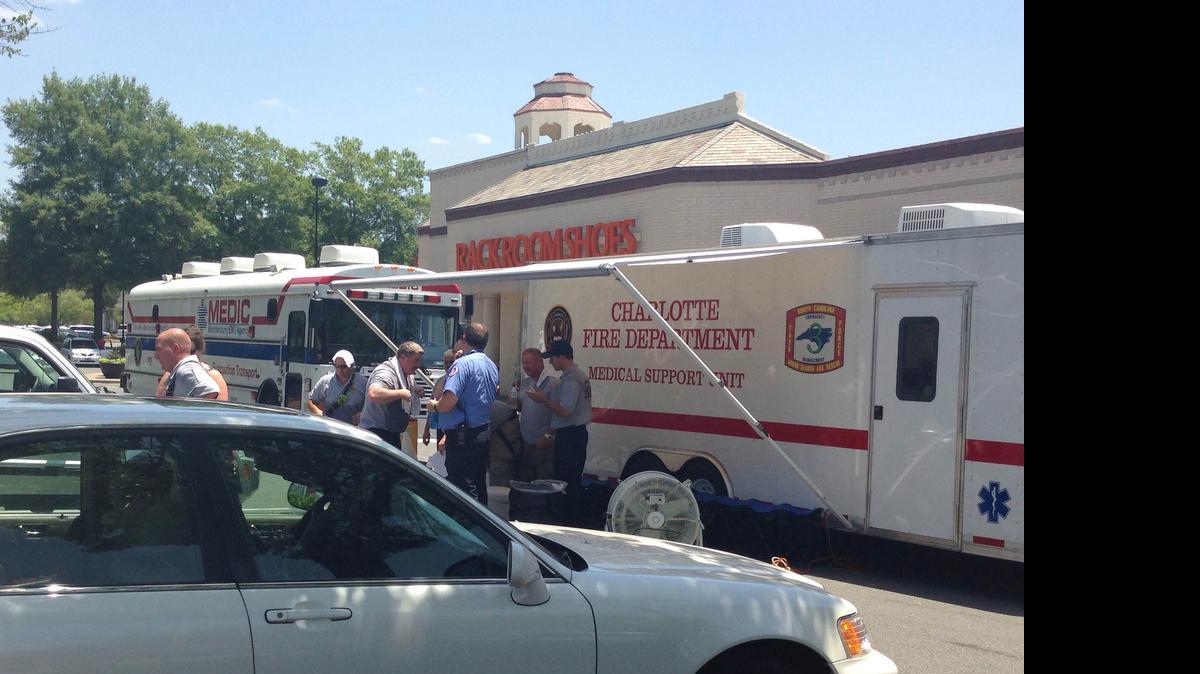 
Firefighters rest in front of a rehabilitation vehicle after working on a cut gas line. The cut line shut down two businesses in the Arboretum Shopping Center in south Charlotte Tuesday.
