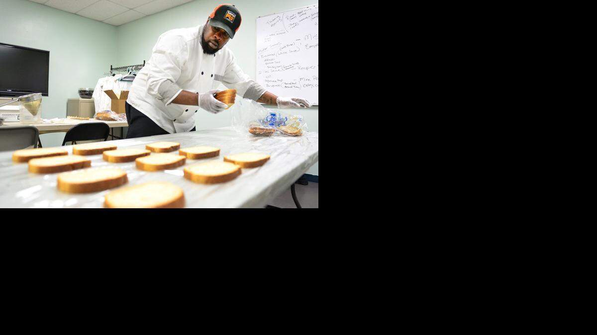 
Chef Chelsa Howard prepares sandwiches at the new Friendship Market on Friday.  The cafe is a nonprofit that will open Wednesday to serve food to the public and make money for the charity.
