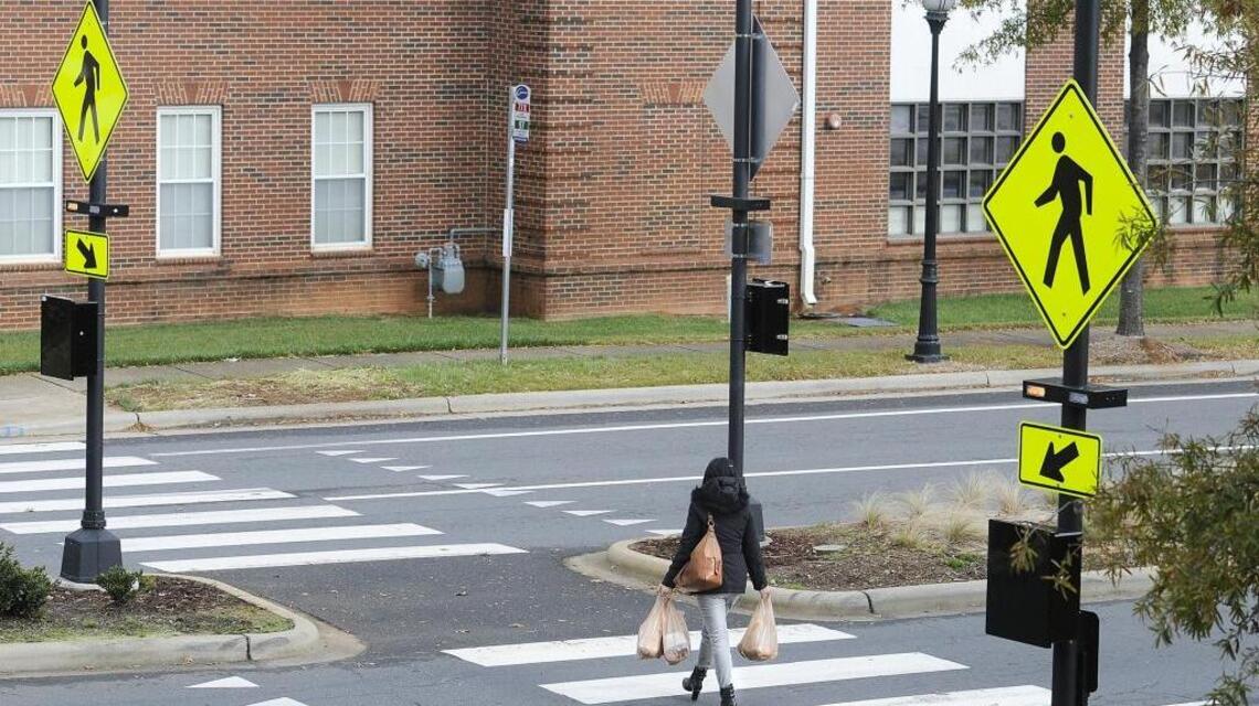 Watch for a flashing red light at crosswalks