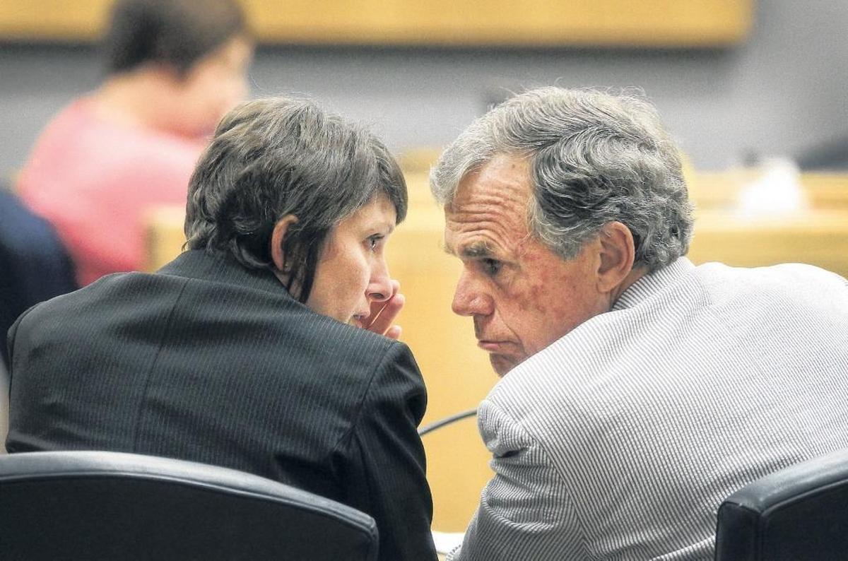 Gaston County District Attorney Locke Bell, right, discusses a case with Assistant District Attorney Stephanie Hamlin. Both prosecutors remain entangled in a dispute with attorneys for convicted murderer Mark Carver over evidence the defense says it needs to prove Carver deserves a new trial. Hamlin was co-prosecutor of the original murder case.