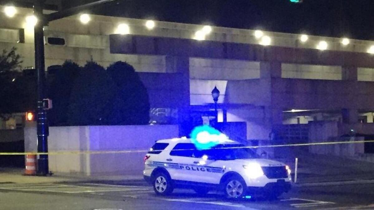 Three men were arrested Sunday after two vehicles and a hotel lobby were damaged in an uptown Charlotte shooting Sunday morning.