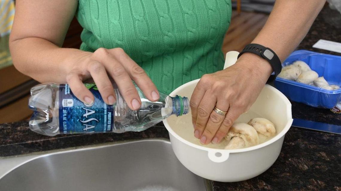 Belmont neighbors of Duke Energy’s Allen power plant cook with bottled water after contaminants were found in their well water in 2015.