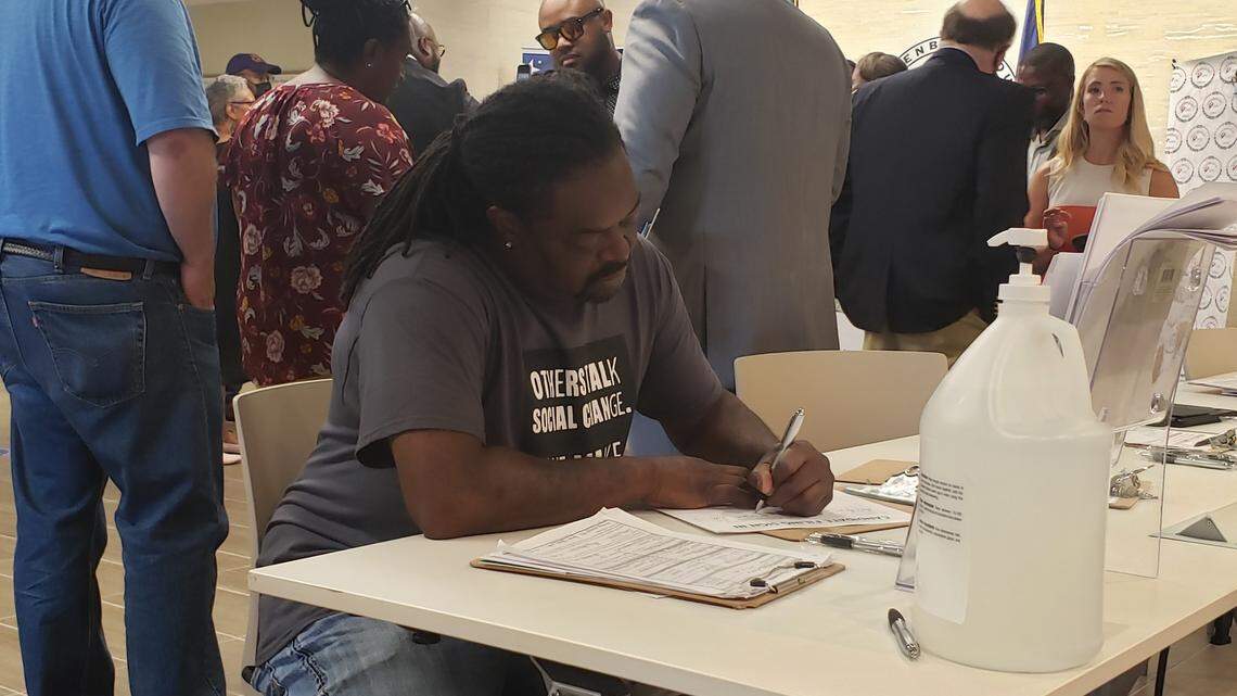 Charlotte-Mecklenburg Board of Education District 2 challenger Juanrique Hall fills out campaign paperwork July 25 at the Mecklenburg County Board of Elections.