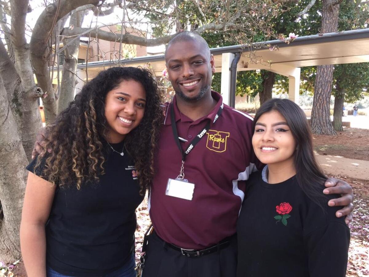 Principal Eric Ward with two students at Harding University High.