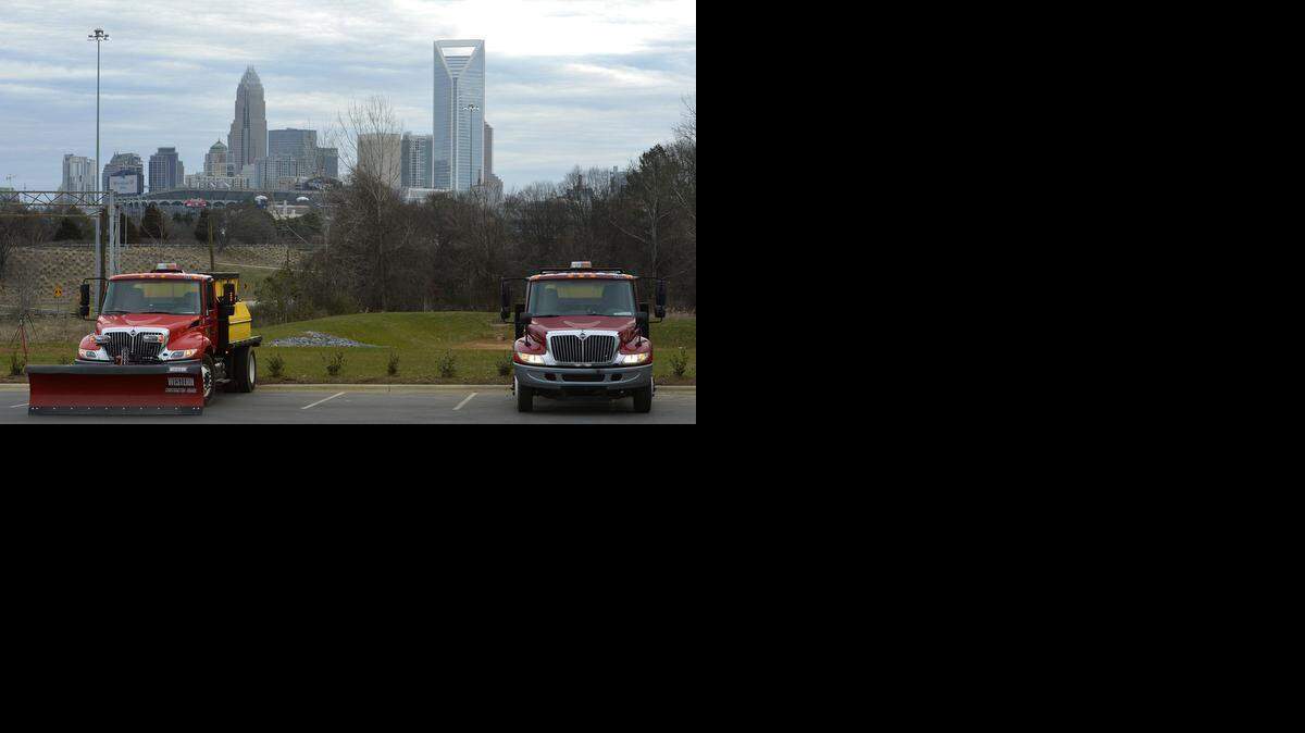 
Snow and ice removal trucks on standby on Wilkinson Boulevard near uptown Charlotte.
