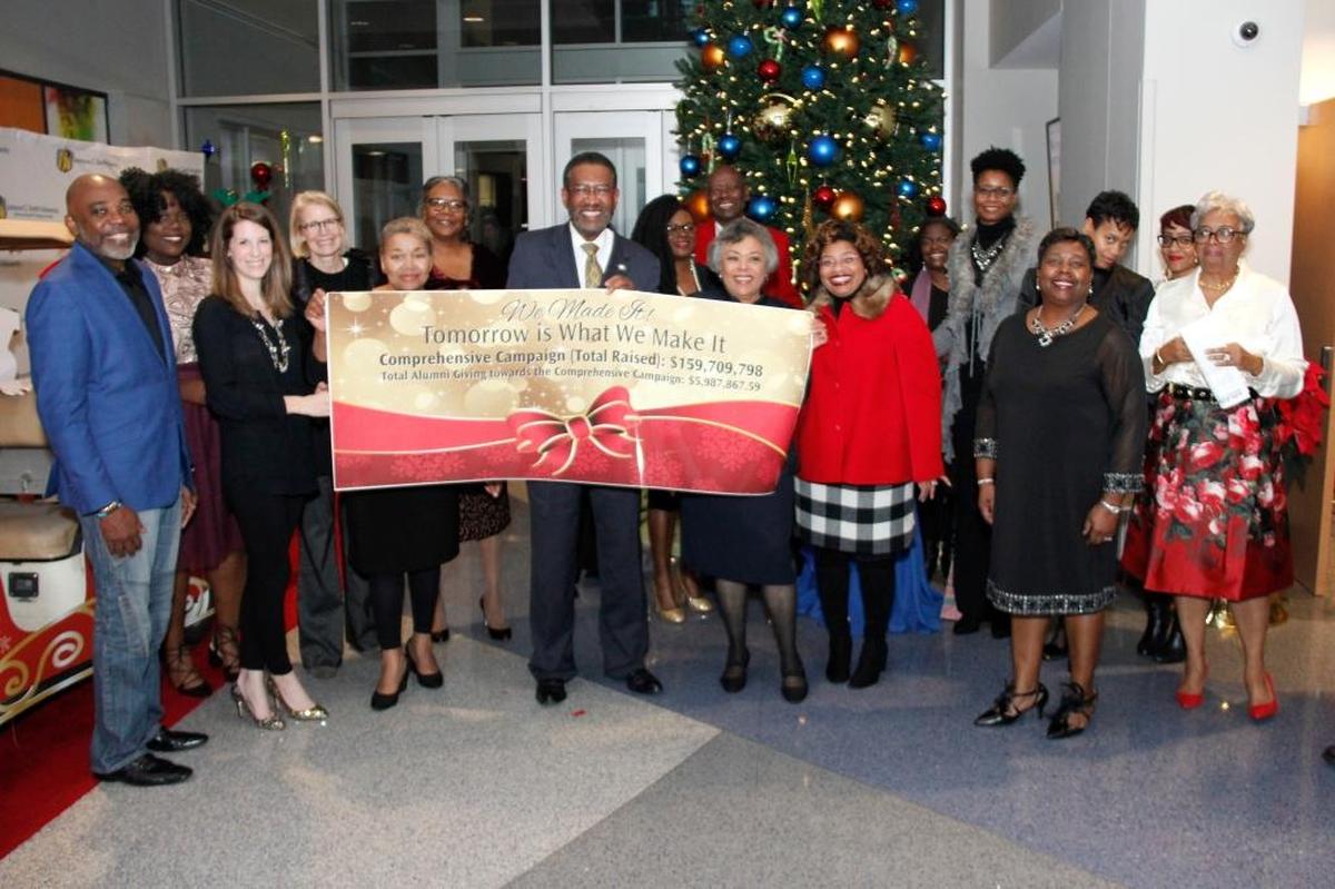 Ron Carter (center), who is about to retire as president of Johnson C. Smith University, poses with others involved in raising $159 million through the “Tomorrow is What We Make It” campaign.