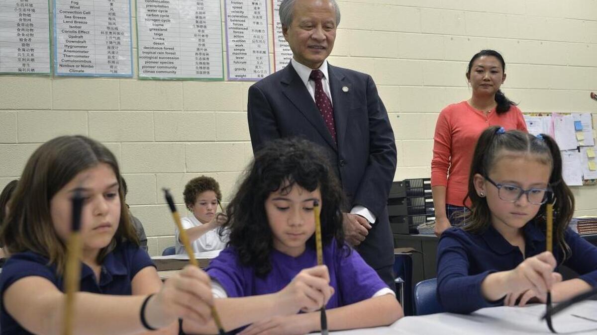 Language magnets feature prominently in the CMS construction plan. Here, students at Waddell Language Academy demonstrate Chinese calligraphy.