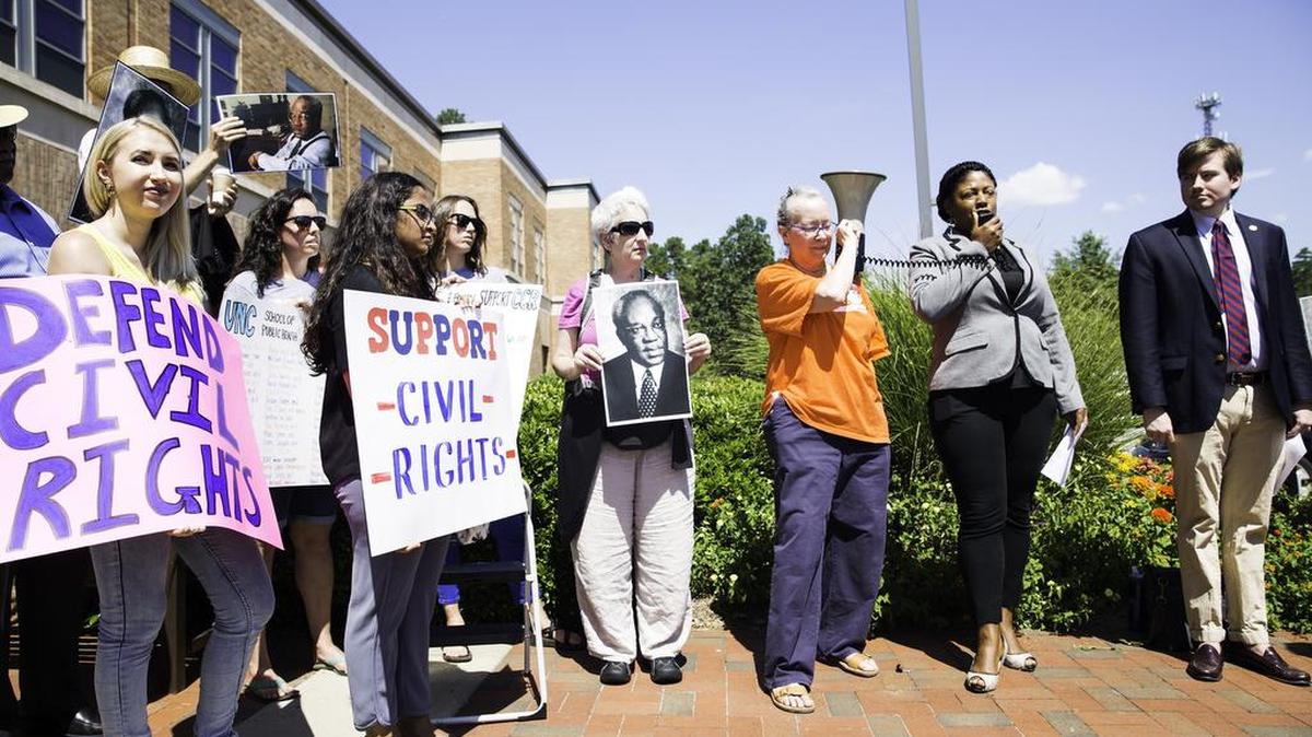 Protesters stand outside The Center for Leadership Development in support of the UNC Civil Rights Center before a committee debate determining the center’s future on Aug. 1 in Chapel Hill.