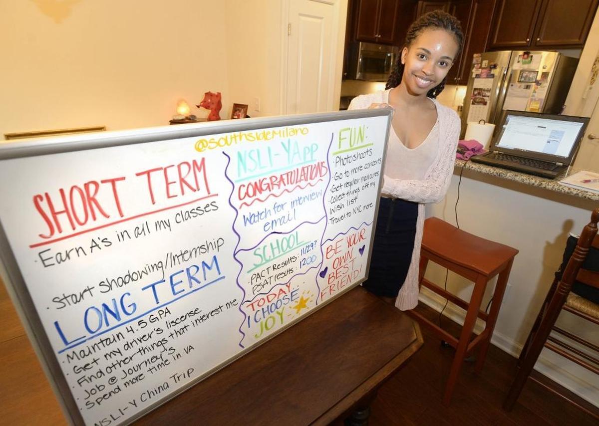 Milan Carter, a 10th-grader in eLearning Academy, uses a whiteboard to keep herself organized and motivated in a virtual high school where she sets her own schedule.