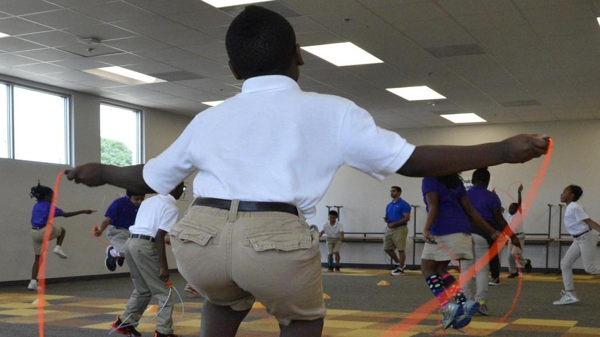 Invest Collegiate’s new building includes indoor exercise space, but the cost has contributed to a deficit, the school says.