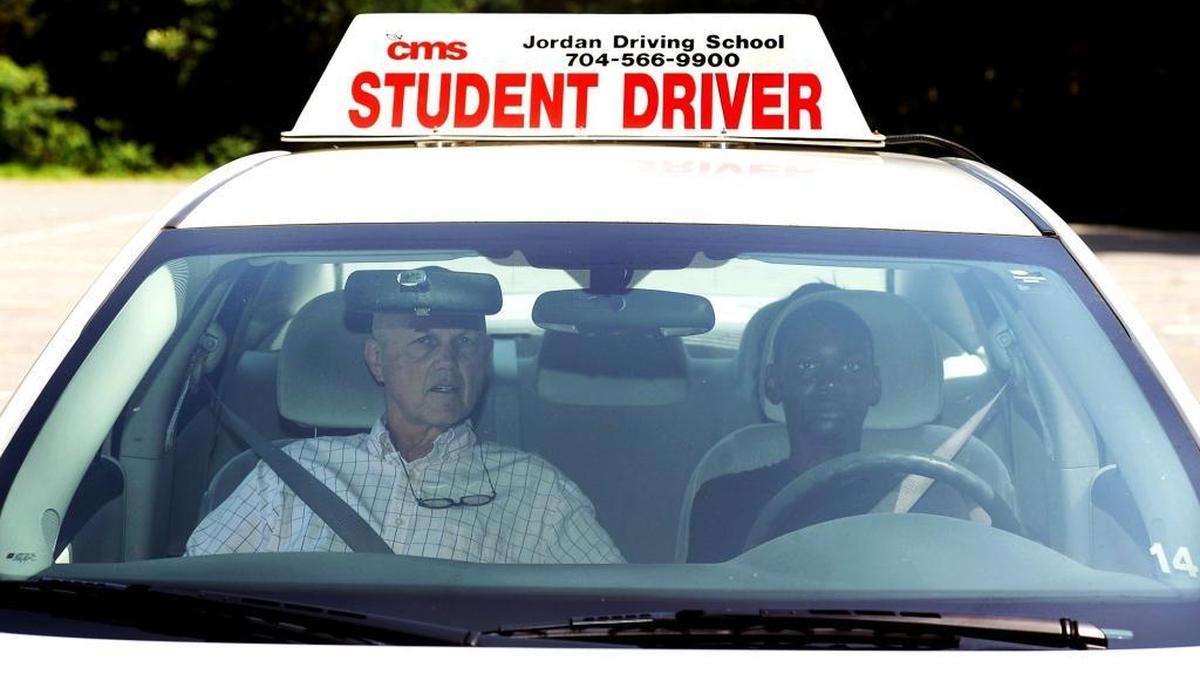 
Instructor Jim Smith of Jordan Driving School and student Montray Porter during drivers education at Myers Park High School earlier this summer. 
