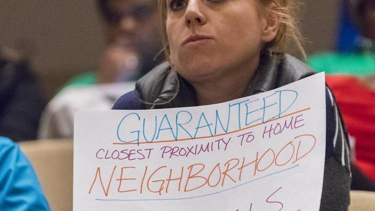 Neighborhood school proponents turned out for a 2016 CMS board meeting on student assignment.