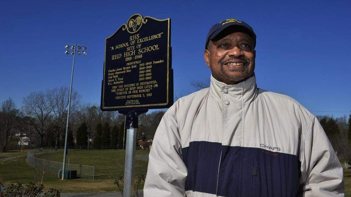 Charles Reid, grandson of Professor Reid stands by the historical marker of Reid High School. The African-American Reid School closed its doors for good 50 years ago, but former students keep its memory alive.