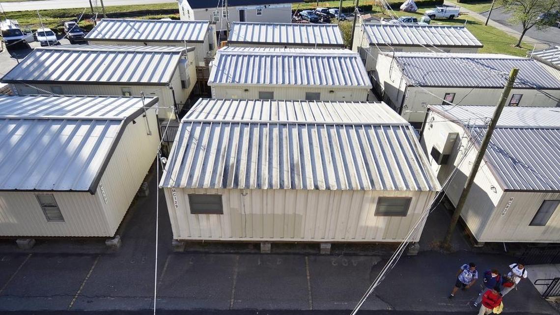 CMS uses more than 1,000 mobile classrooms to accommodate overflow enrollment. They symbolize many of the district’s budget challenges, from managing enrollment change to protecting students from attack.