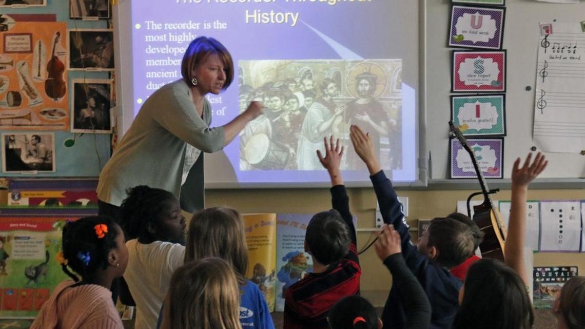 Douglas Elementary School music teacher Susan Zelasky, upper left, asks questions of her 3rd grade music students during a session on the history of the recorder wind instrument on March 23, 2015 at the Raleigh school. Zelasky is among 109 teachers in the Wake County school system who renewed their National Board for Professional Teaching Standards certification in 2016.
