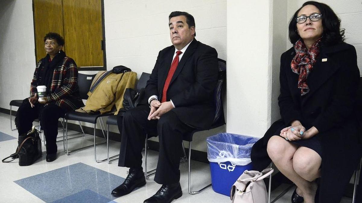 Clayton Wilcox sits between CMS board Chair Mary McCray (left) and Vice Chair Elyse Dashew (right) as he waits to speak at the Tuesday Breakfast Forum hours before the contract vote.