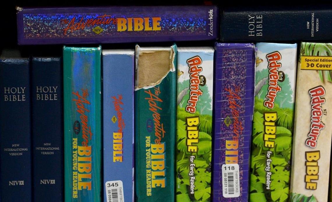 Bibles and other religious books sit on a classroom shelf at Mountain Island Day School, currently a preK-12 Christian school. Such material must go when it converts to a charter school next year.