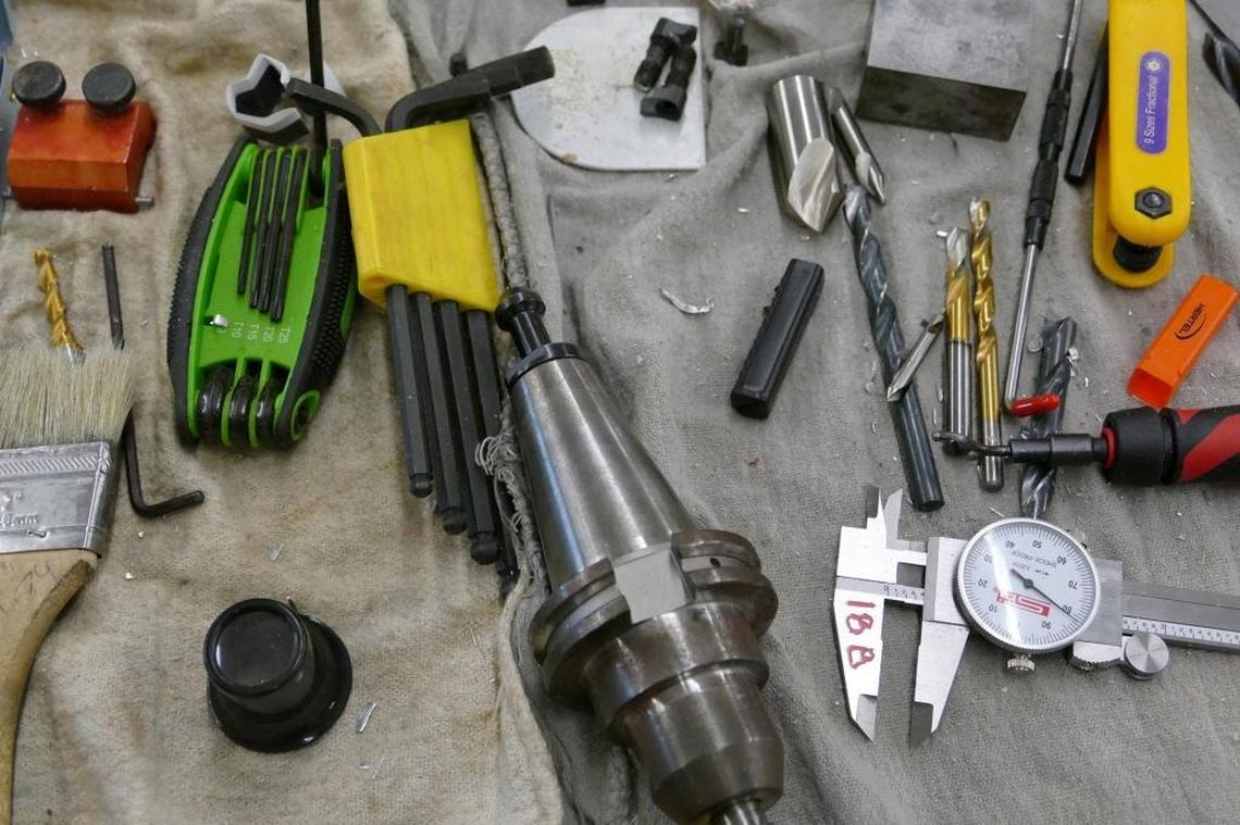 The lab at Olympic’s school of advanced manufacturing includes old-school hand tools as well as expensive computerized equipment.