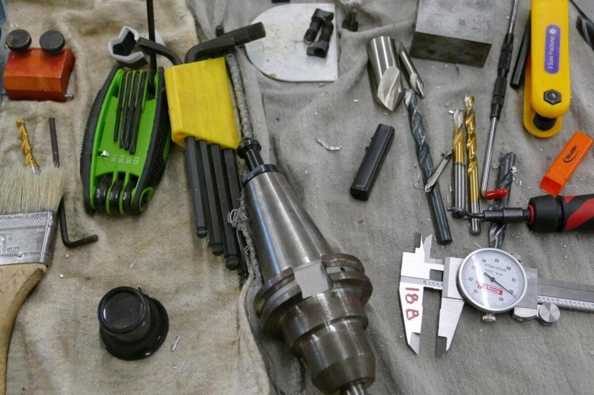 The lab at Olympic’s school of advanced manufacturing includes old-school hand tools as well as expensive computerized equipment.