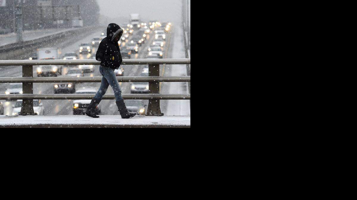 
A pedestrian crosses over Interstate 85 on West Sugar Creek Road on Tuesday.

