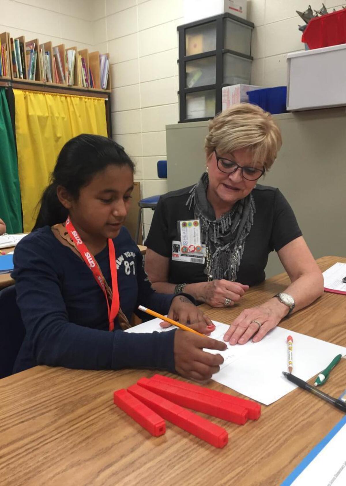 Tutor Cate Rogers works on math with a student as part of Heart Math Tutoring, a nonprofit organization that sends hundreds of volunteers into Charlotte Mecklenburg Schools to help students learn basic math concepts.