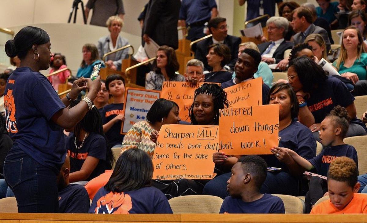 Supporters of Morehead STEM Academy turned out to protest a plan that would turn the K-8 magnet school into a neighborhood elementary school with a STEM magnet included.