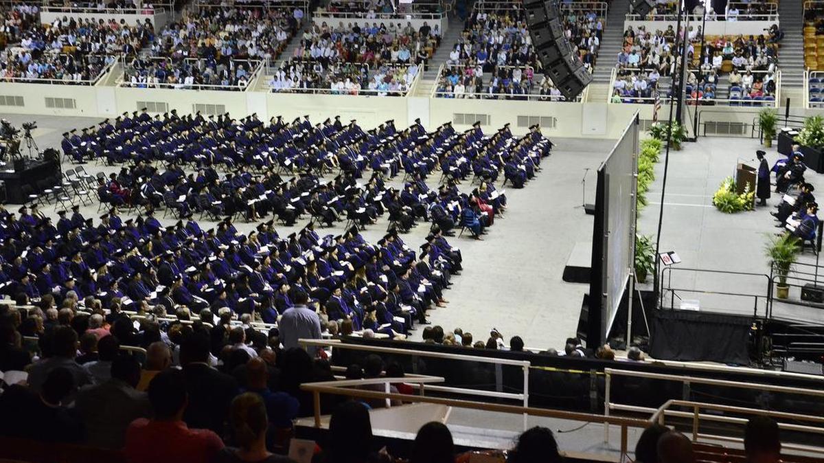 About 320 hooded students graduated in May 2014 during Spring commencement exercises from the Charlotte School of Law at Bojangles Coliseum. The American Bar Association this week put the school on probation, demanding reports on the for-profit college’s admission practices and requiring it to tell students how many of its graduates are passing bar exams.