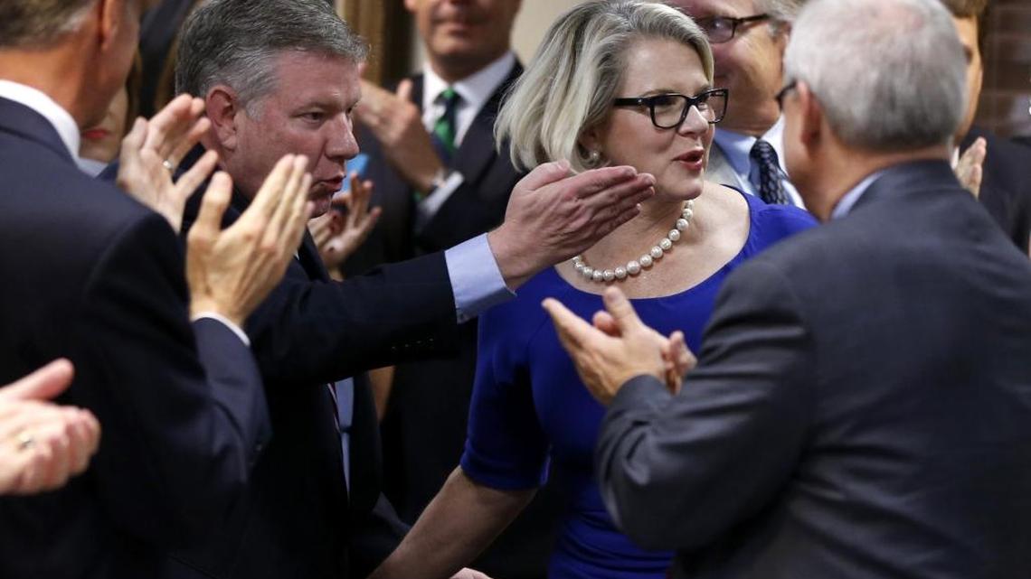 Margaret Spellings is given a standing ovation as she is escorted into the room after being elected president of the University of North Carolina system during a meeting of the UNC Board of Governors at the Spangler Center in Chapel Hill, N.C., Friday, Oct 23, 2015.