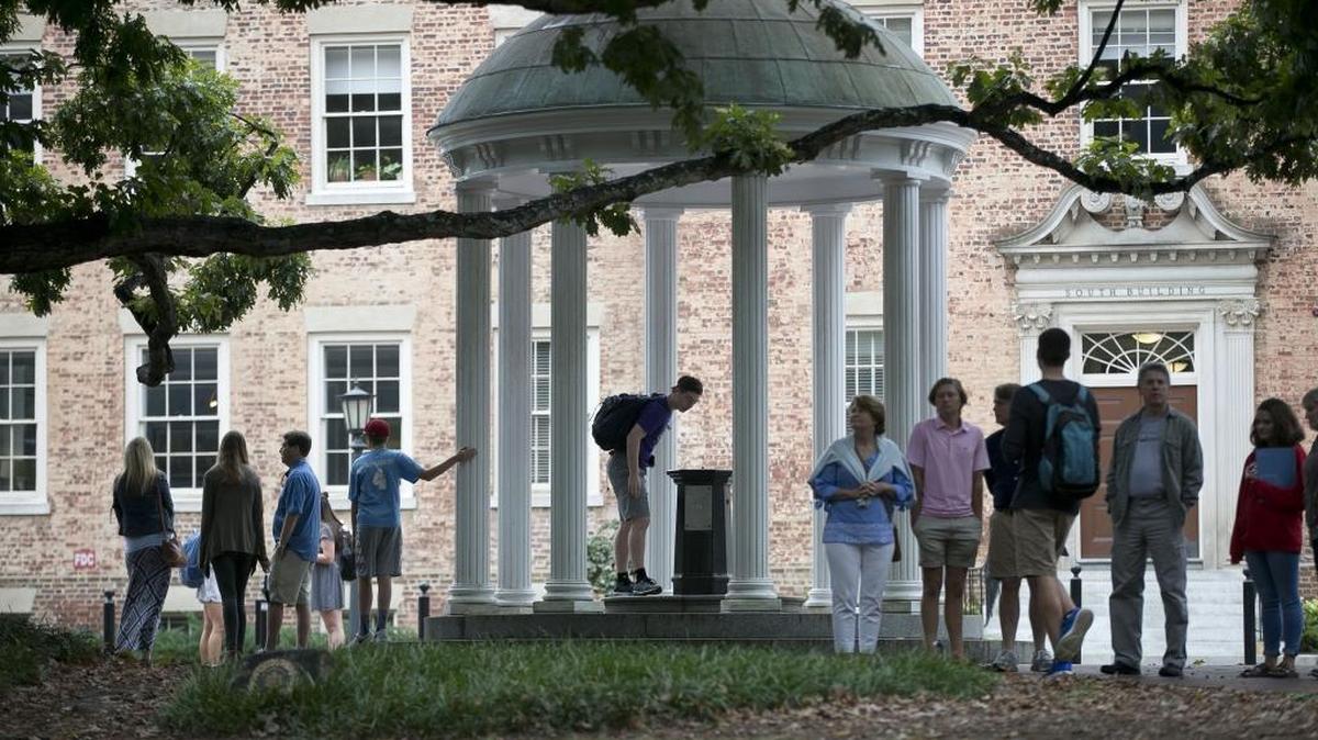 A steady stream of visitors and students visit the Old Well on the University of North Carolina campus in this 2017 photo.