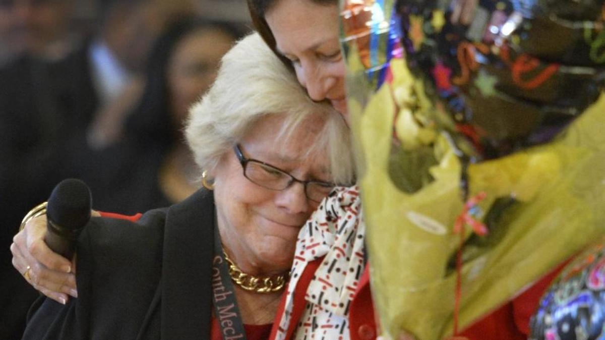 South Mecklenburg Principal Maureen Furr (left) is congratulated by Superintendent Ann Clark as she’s named Charlotte-Mecklenburg Schools principal of the year in October.