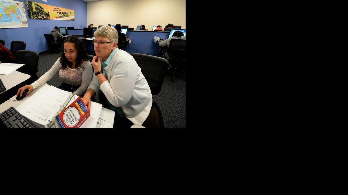 
Magdalena Enriquez, left, works with social studies adviser Teresa Thomas at Commonwealth High School in east Charlotte, a charter school that Accelerated Learning Solutions opened in 2014.
