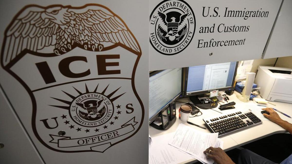 In this file photo, an unidentified Immigration and Customs Enforcement deportation officer reviews forms required to issue a detainer asking local law enforcement to hold someone until ICE agents can pick the person up.