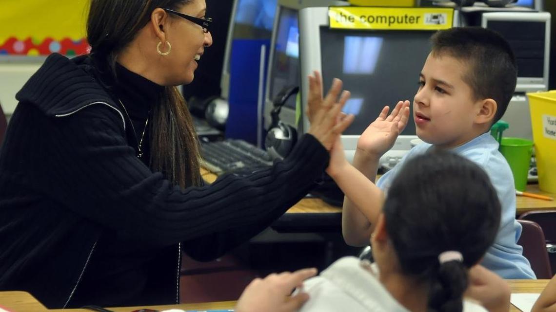 
Teacher assistants like Celine Nina of Collinswood Language Academy provide individual help to young students.

