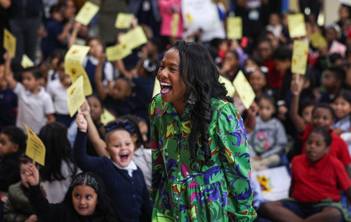 LaTresha Wilson, principal of Tuckaseegee Elementary School, celebrates as she is named the 2026 Principal of the Year in Charlotte on Friday, Oct. 3.