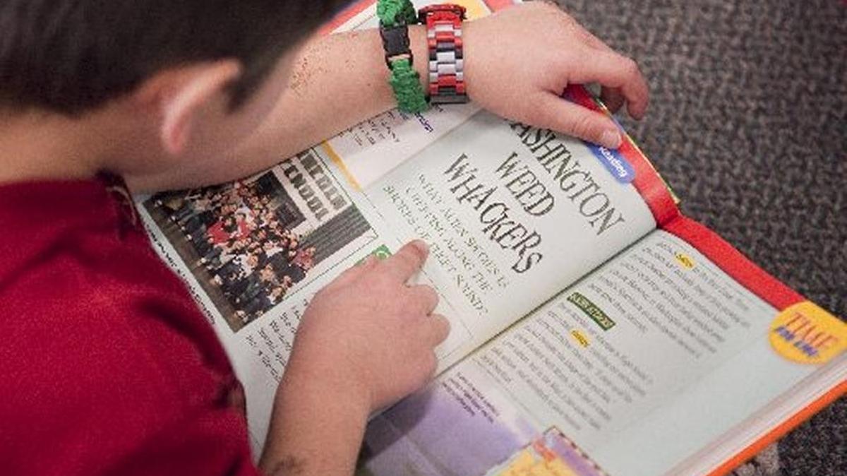 Students track their summer reading time in Scholastic’s summer reading challenge.