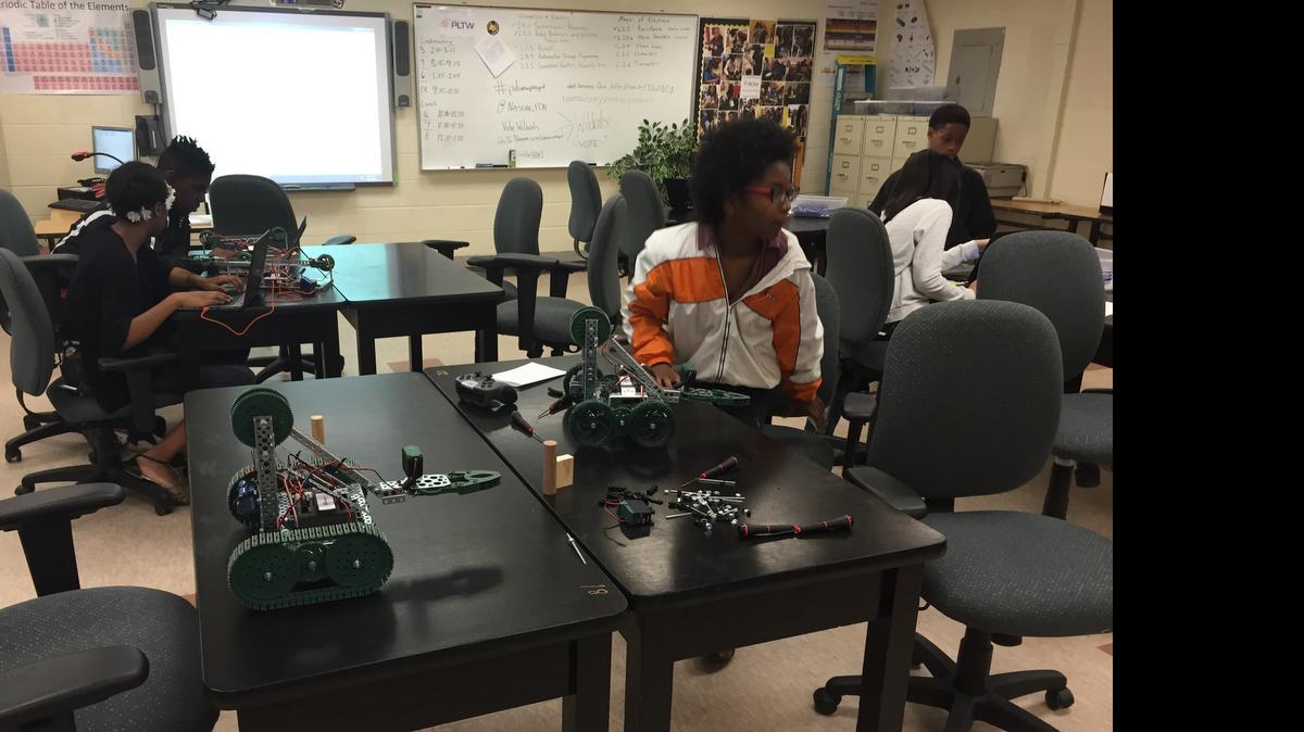 
Coulwood Middle seventh-grader Serenity Elder, center, works on a robot a class built. Her school has a science, technology engineering and math magnet program that still has seats open.
