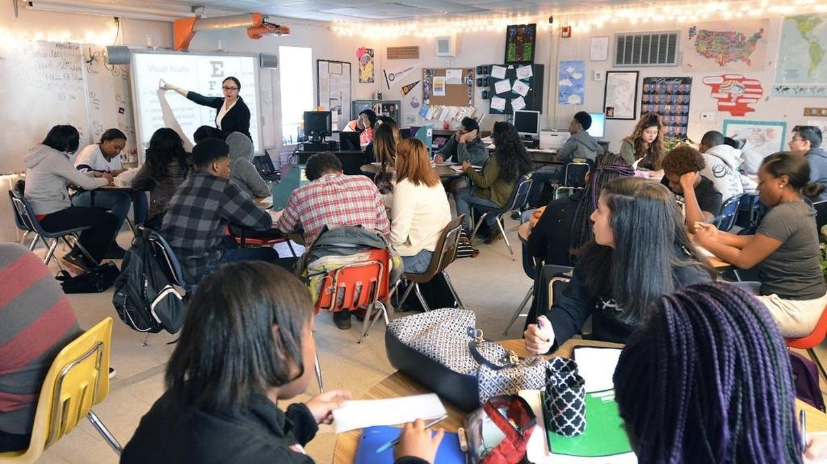 Students listen to social studies teacher Ashley Austin during class at Olympic High Friday. Parents say crowding is a big problem, with rapid population growth expected to continue in southwest Charlotte.