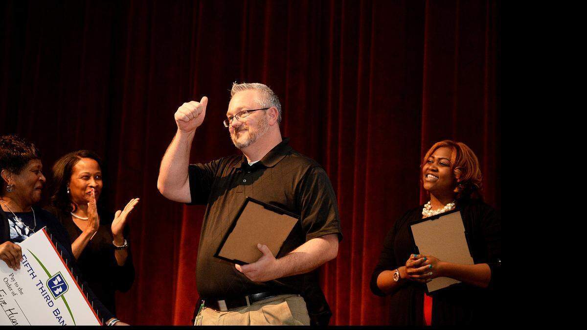 
Matthew Dukes, a teacher at Rivergate Elementary, celebrates as he was named the CMS Teacher of the Year on Wednesday May 6, 2015 at Mallard Creek High School. 
