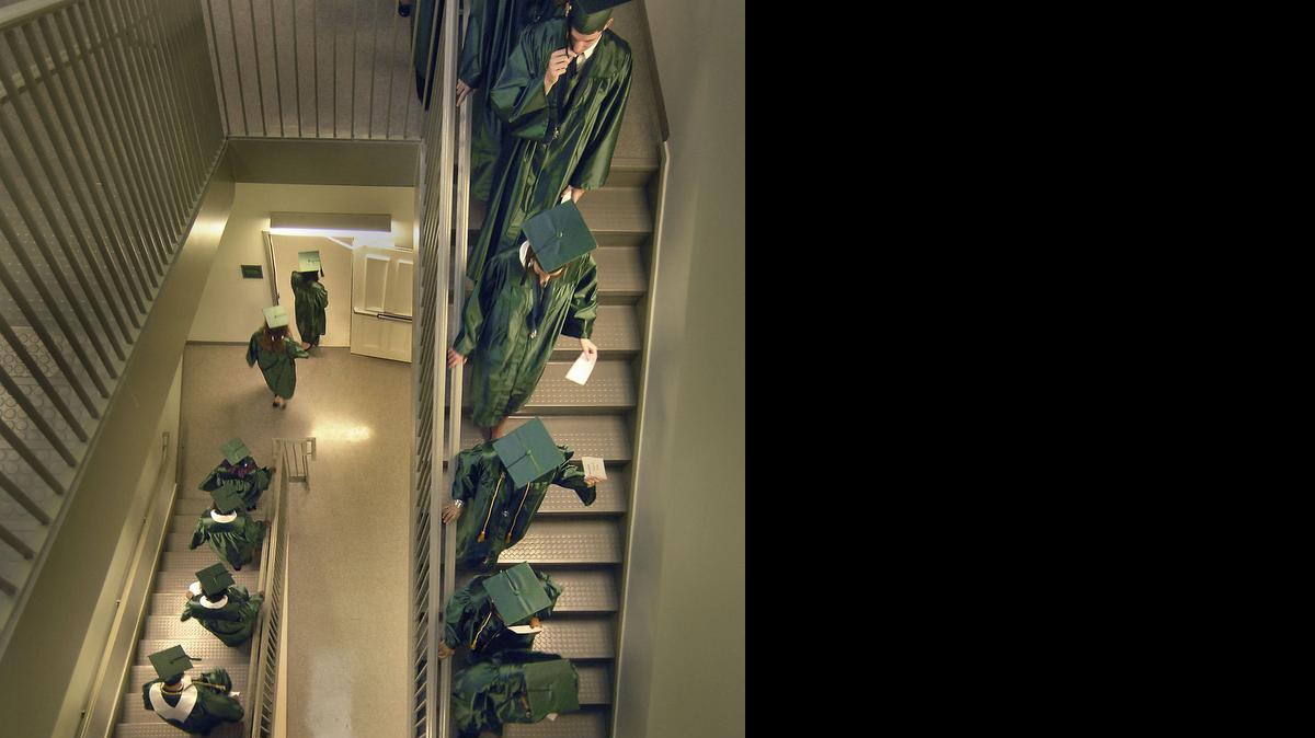 
Cato Middle College High students wind their way through a stairwell prior to commencement exercises in 2009. TODD SUMLIN - tsumlin@charlotteobserver.com
