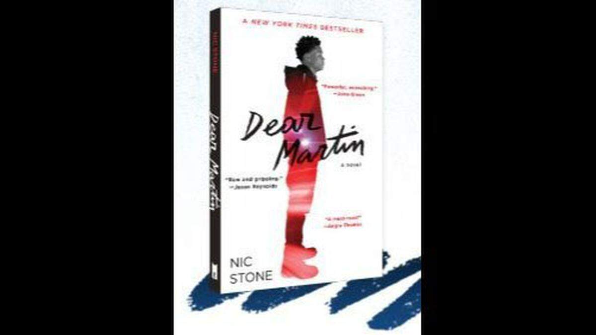 A Charlotte middle school teacher says he was fired for teaching his students about the book “Dear Martin.”