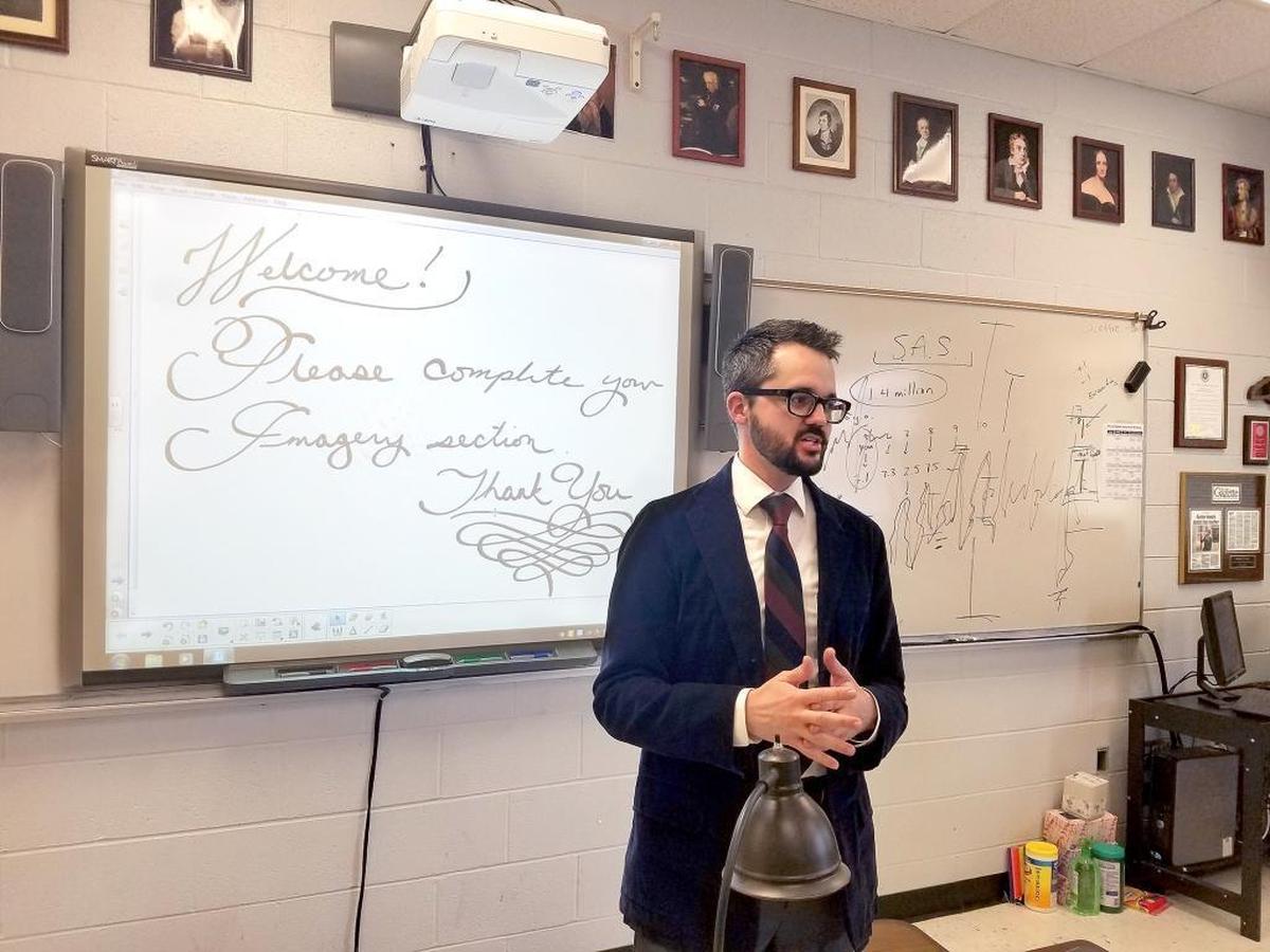 Bobbie Cavnar uses a Smart Board to write old-fashioned calligraphic classroom instructions. He likes to remind students at Belmont’s South Point High that taking time to make something beautiful is worthwhile.