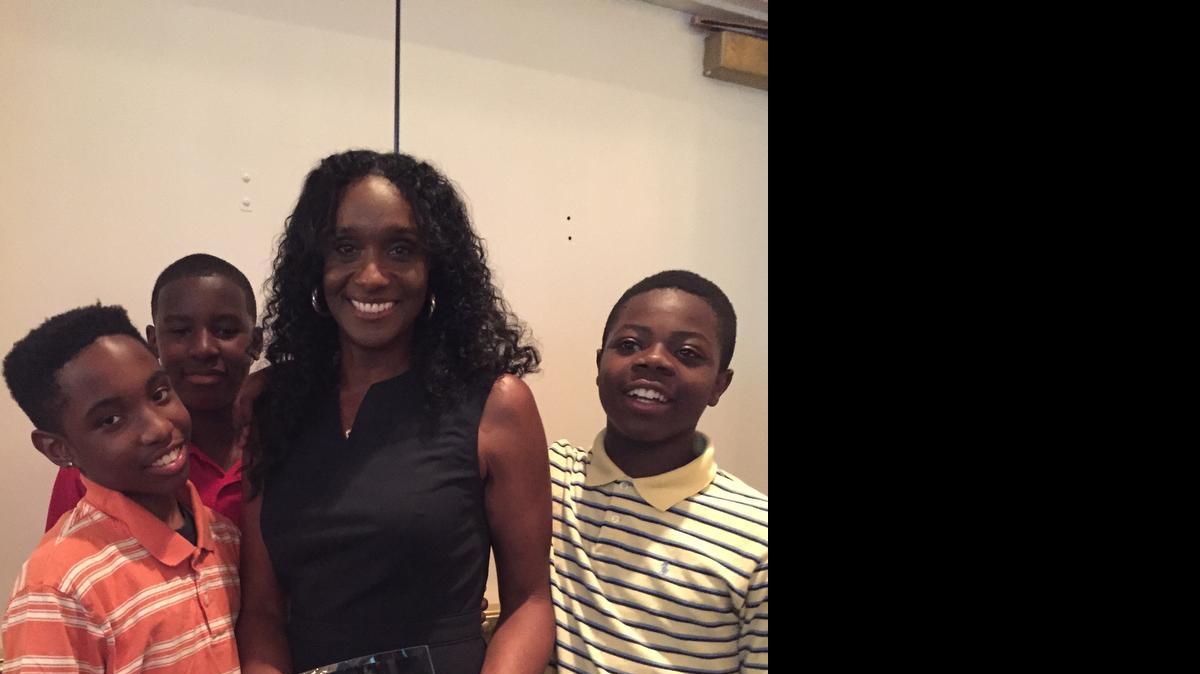 
Coretta Wilson, the 2015 Paul Jackson Award winner, celebrates with her students Cario Walker, left, Jacoby Thompson and Marcha Simmons on Wednesday, May 20, 2015.
